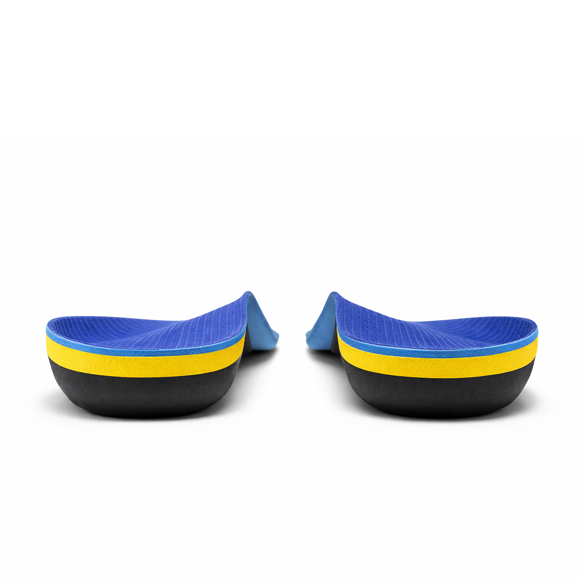 A pair of Comfort Step Pro Arch Insoles next to a pair of work sneakers